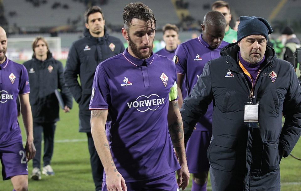  Fiorentina players walk off dejected after suffering a second half collapse