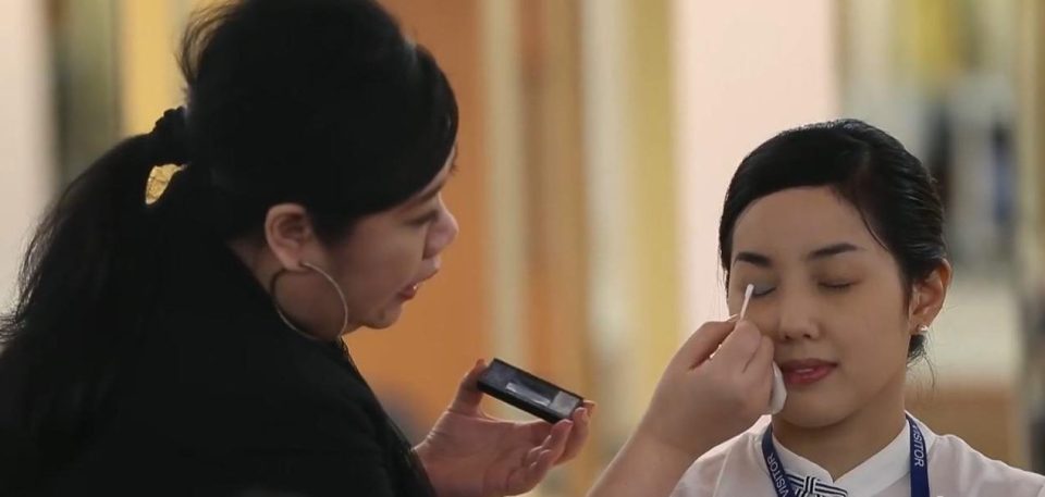  The women are also shown how to wear their hair and apply their make-up