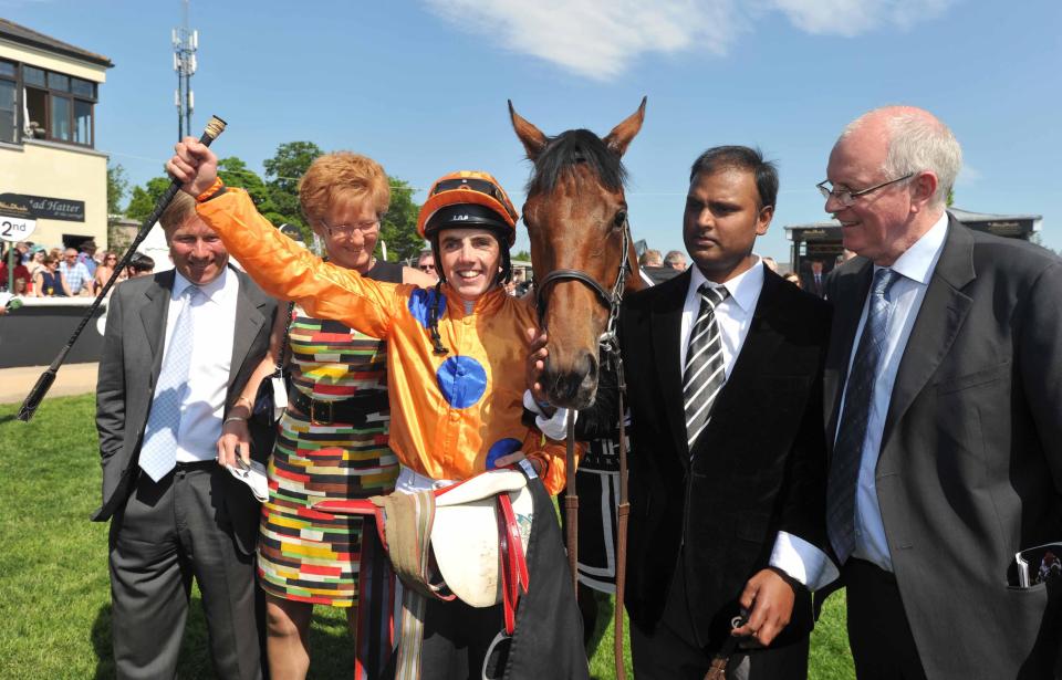  Channon (right) with Jockey Martin Harley as he kisses Samitar in the winners enclosure after winning the Ethihad Airways Irish 1,000 Guineas during the Abu Dhabi Irish Guineas Festival at Curragh Racecourse