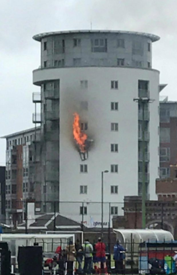  Smoke was seen billowing from a fourth-floor window above a Tesco Express