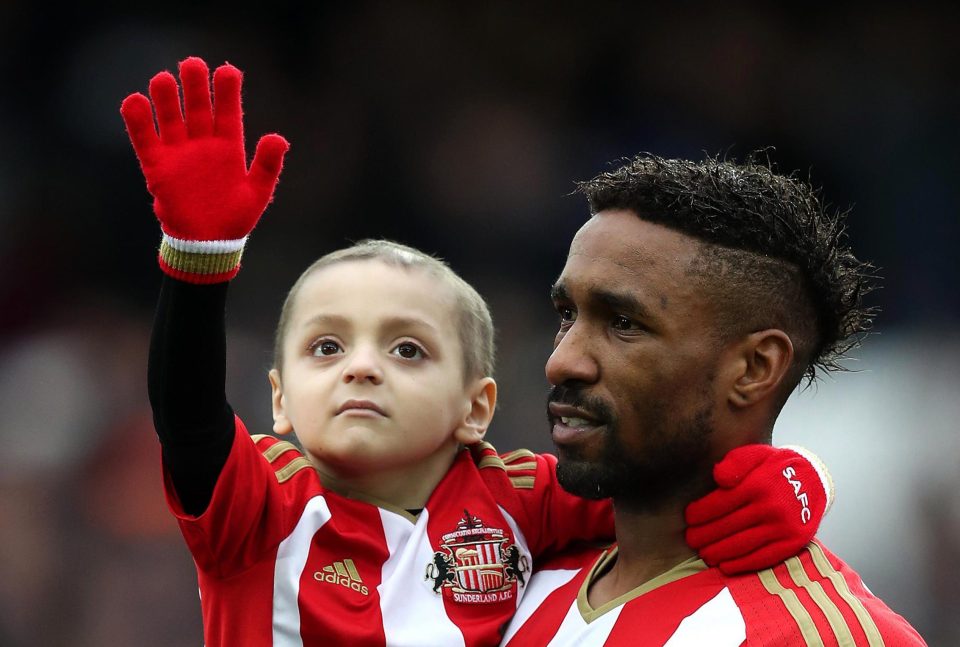  Brave Bradley waved to the crowds as he was carried on to the pitch