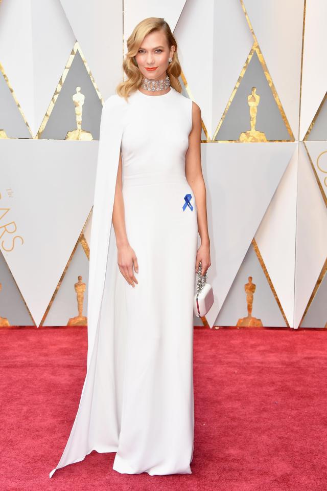  Model Karlie Kloss wore a striking white gown which perfectly emphasised her statuesque frame