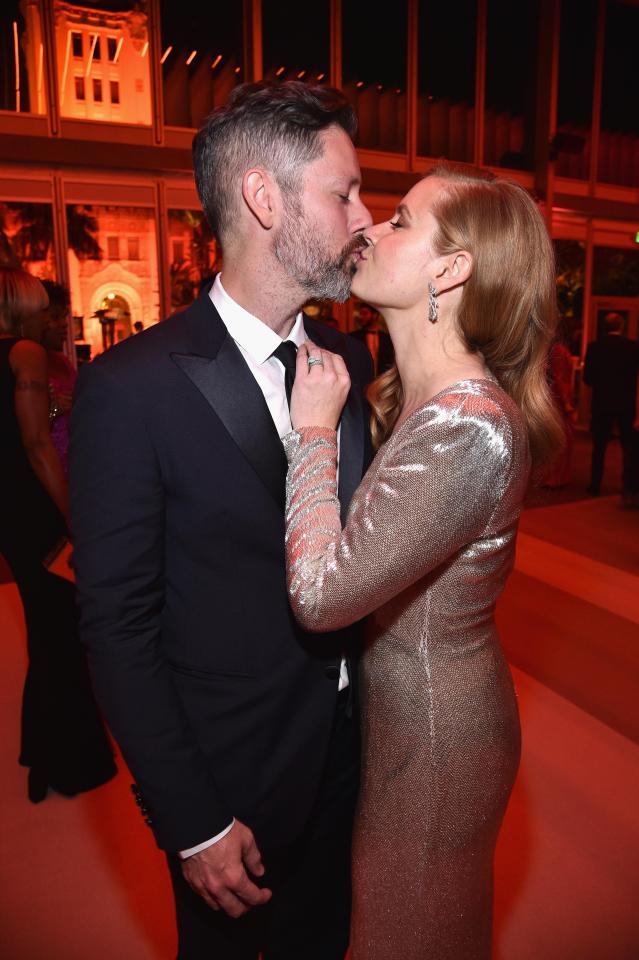  Amy Adams puckered up for a kiss with Darren Le Gallo