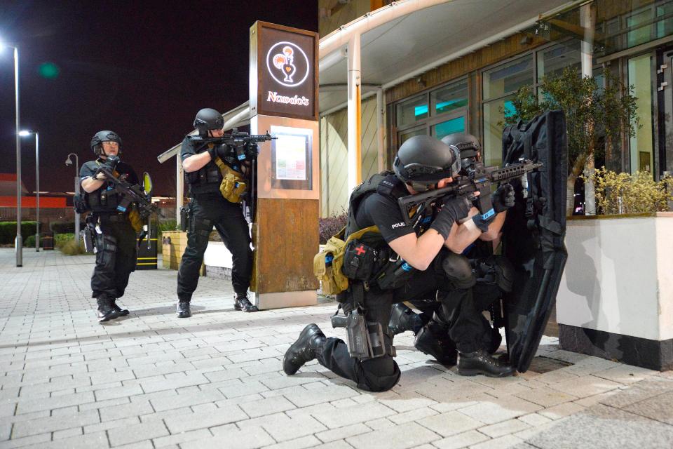  Heavily armed officers were seen taking up positions outside this Nando's in Dudley, West Midlands