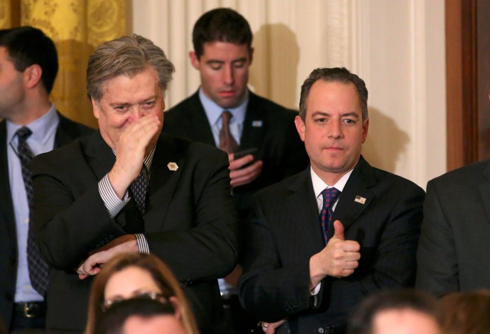  White House Chief Strategist Stephen Bannon (L) and Chief of Staff Reince Priebus (R) reacted with a salute and a thumbs up