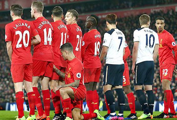  Philippe Coutinho adopts an unusual position at a Tottenham free kick