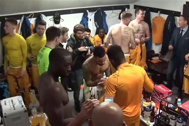  Theo Walcott signed shirts for Sutton United players after the FA Cup clash