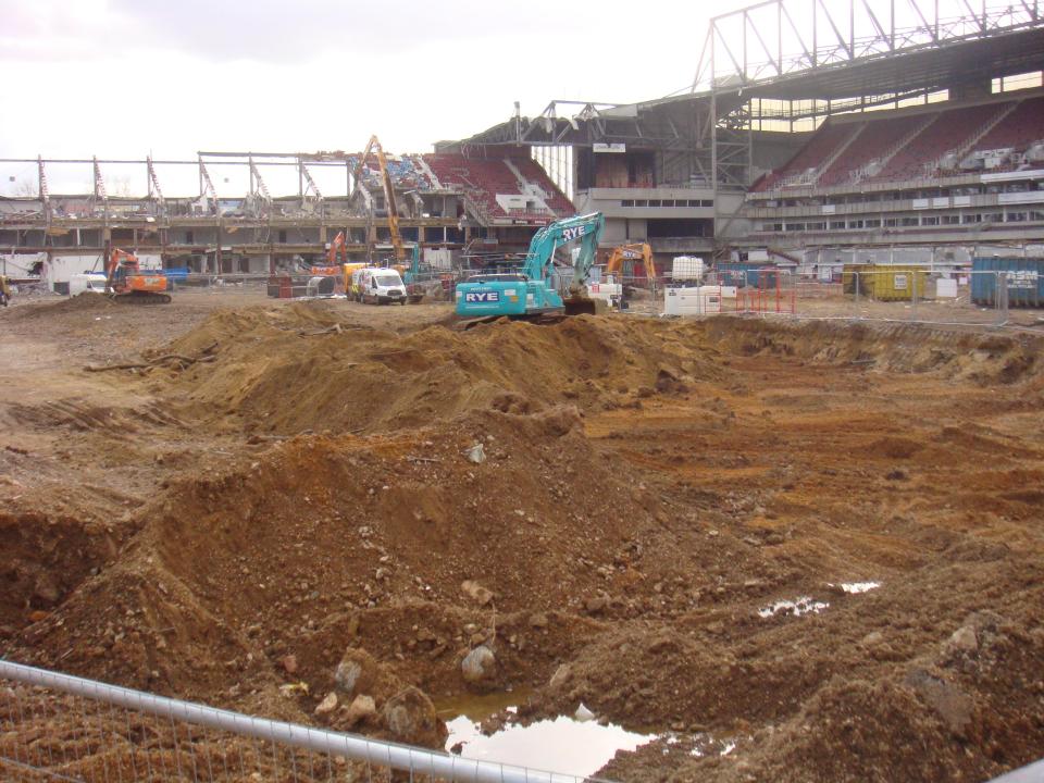  Numerous diggers are at work as they bring down the iconic ground