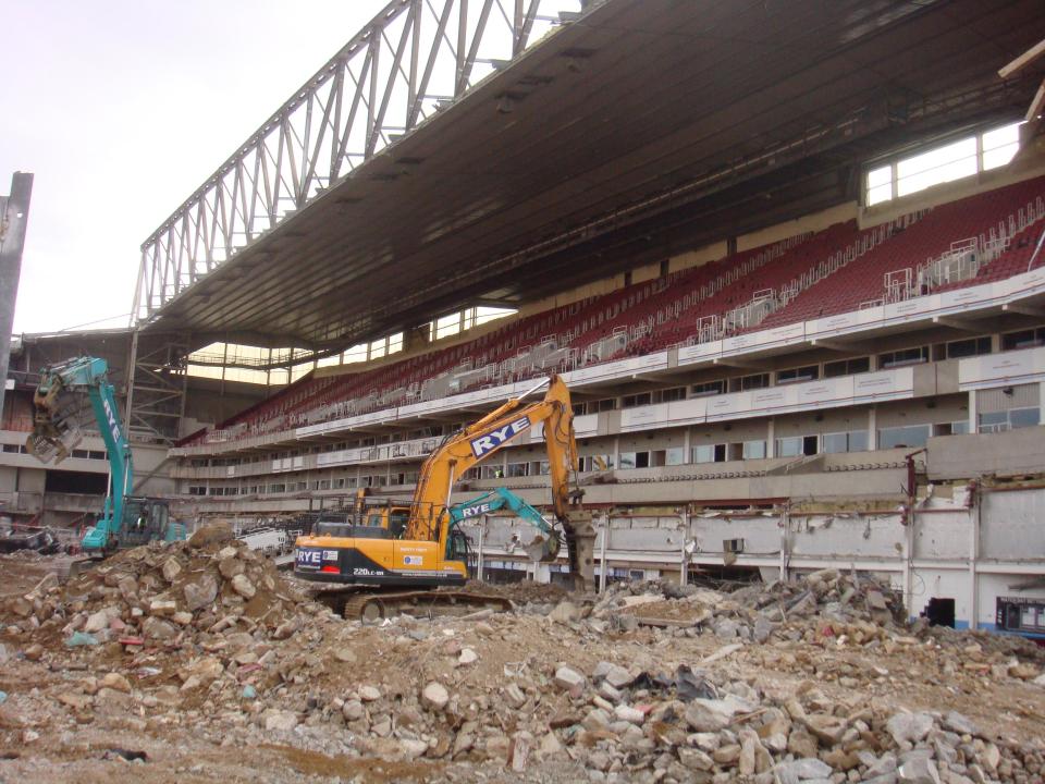  A digger is parked in the middle of Upton Park as it is getting demolished