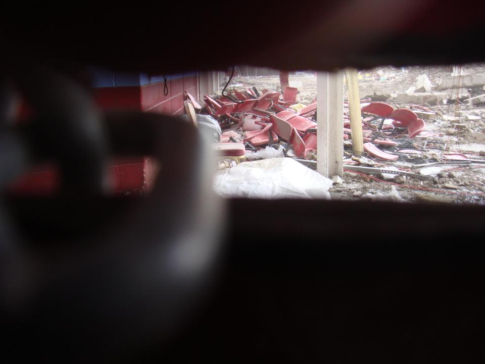  Old seats from the stadium are seen dumped on the floor as part of the rubble