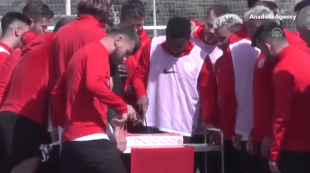  Samuel Eto'o looked happy as he sliced into his big birthday cake