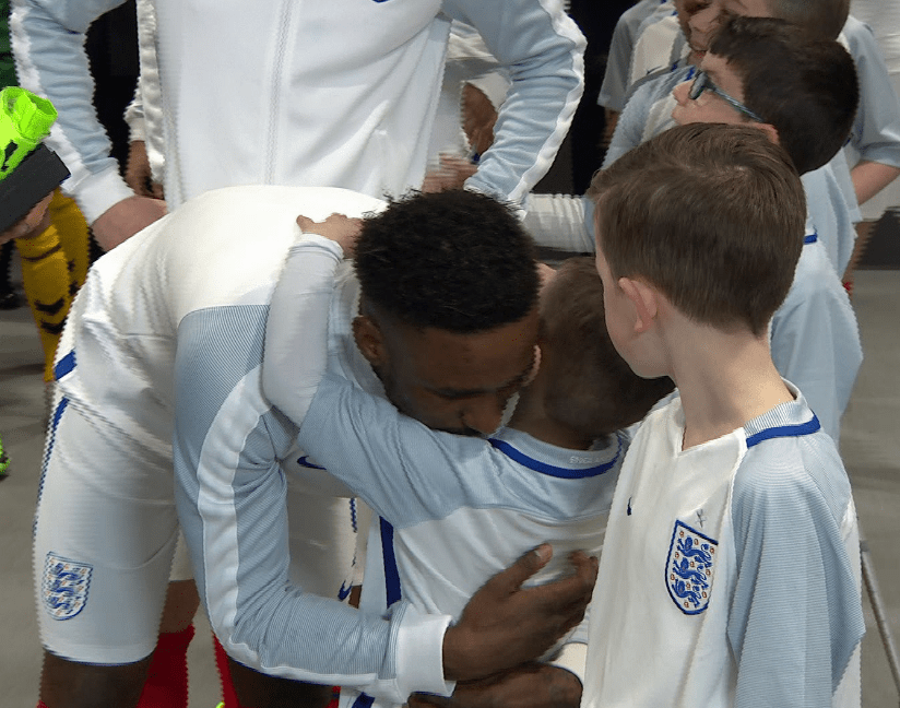  Bradley Lowery hugs best mate Jermain Defoe before leading out the England team