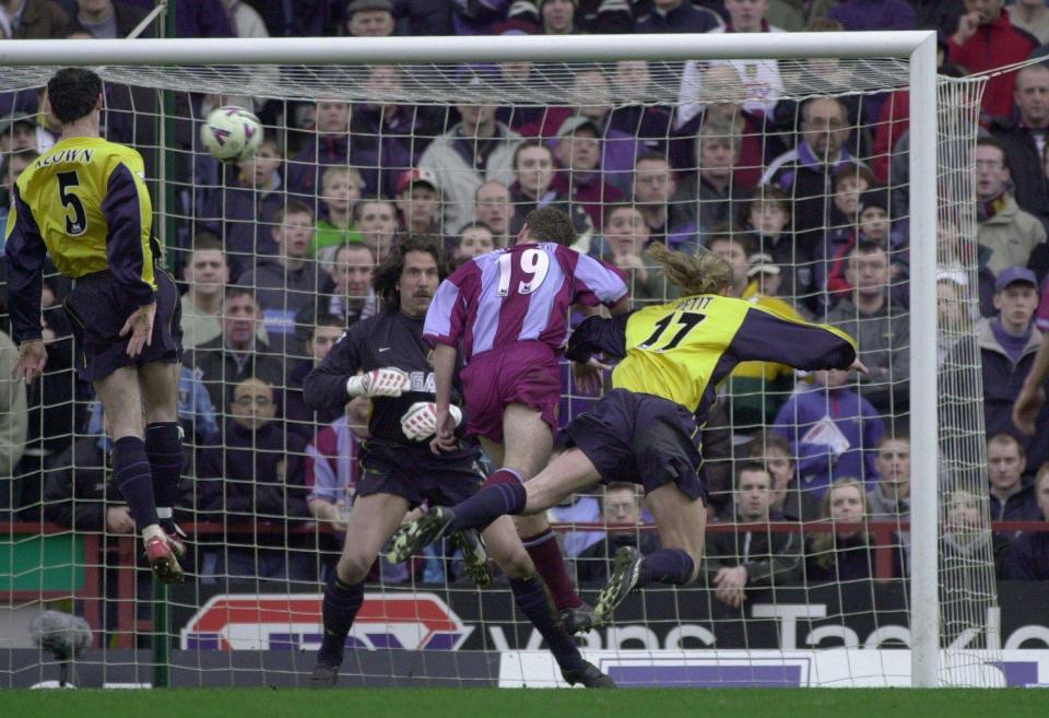  Richard Walker rises to head in against Arsenal keeper David Seaman in 2000