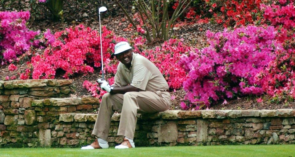  Vijay Singh takes a seat with the fully in-bloom flowers behind him