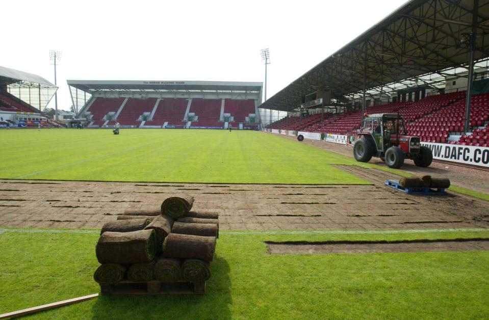  The turf is laid down at East End Park ahead of the first professional game in Europe to be played on it, between Dunfermline and Celtic