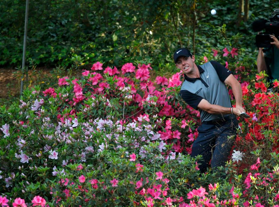  Rory McIlroy hits out from the azaleas on a hole called azalea, the 13th