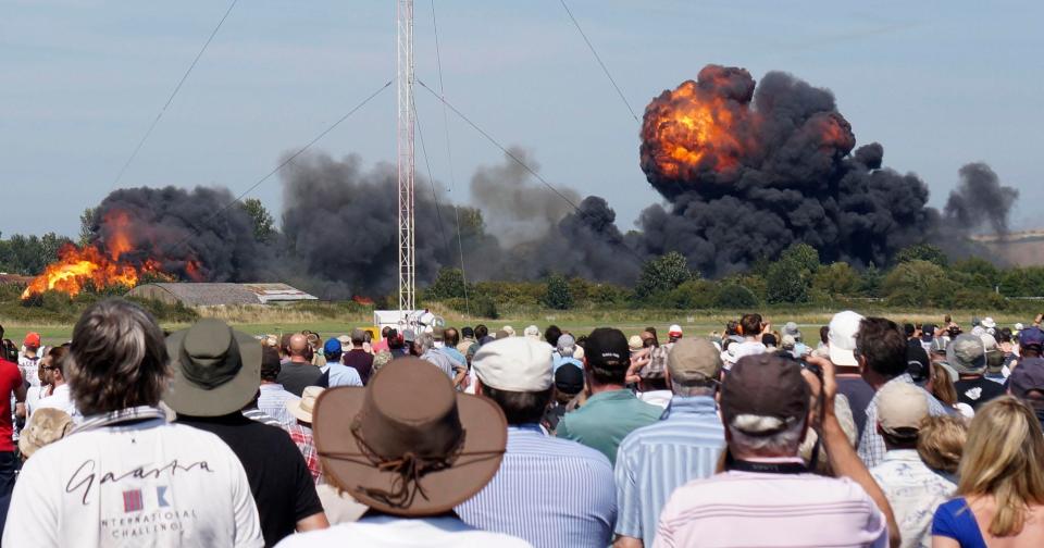  Shocked airshow attendees watch on as a devastating explosion takes place following the smash, in August 2015