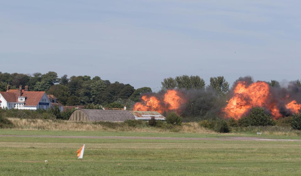  Flames erupt from the site of the fatal accident at Shoreham-by-Sea