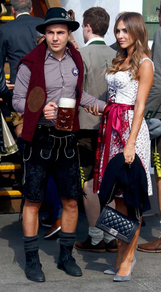  Mario Gotze and Ann-Kathrin Broemmel pose as they arrive at the Oktoberfest in 2015