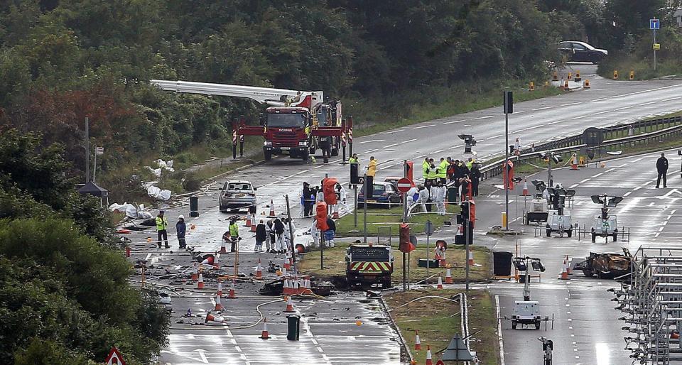  The plane's fuselage was scattered across the road after the horror crash