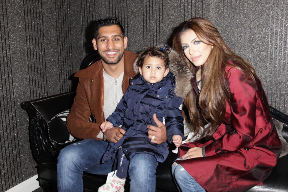  Pleased as punch ... the couple, pictured with their child, are on stronger terms following their public spat with Amir's parents