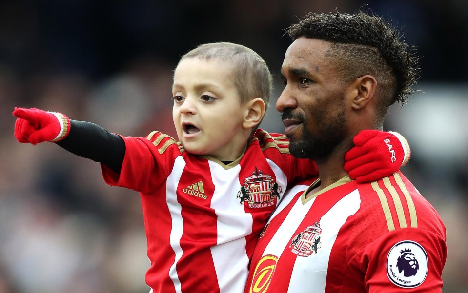 Jermain Defoe carries Bradley onto the pitch for Sunderlands game against Everton in January