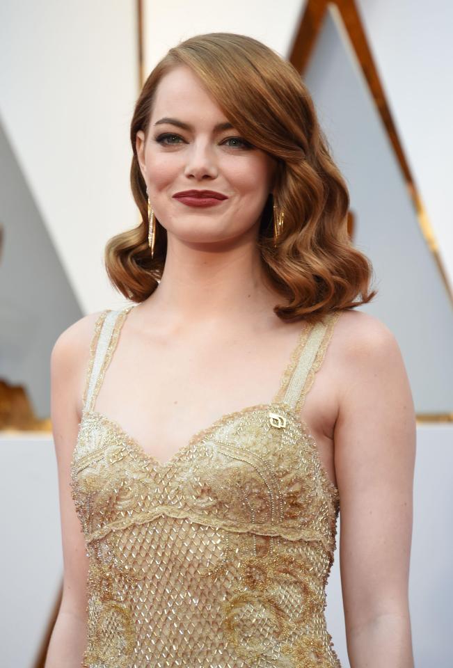  Best Actress winner, Emma Stone goes vintage this year with her waves on the red carpet