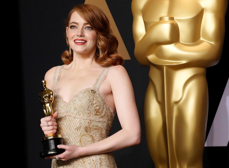  Emma poses with her Best Actress Oscar for her role in La La Land