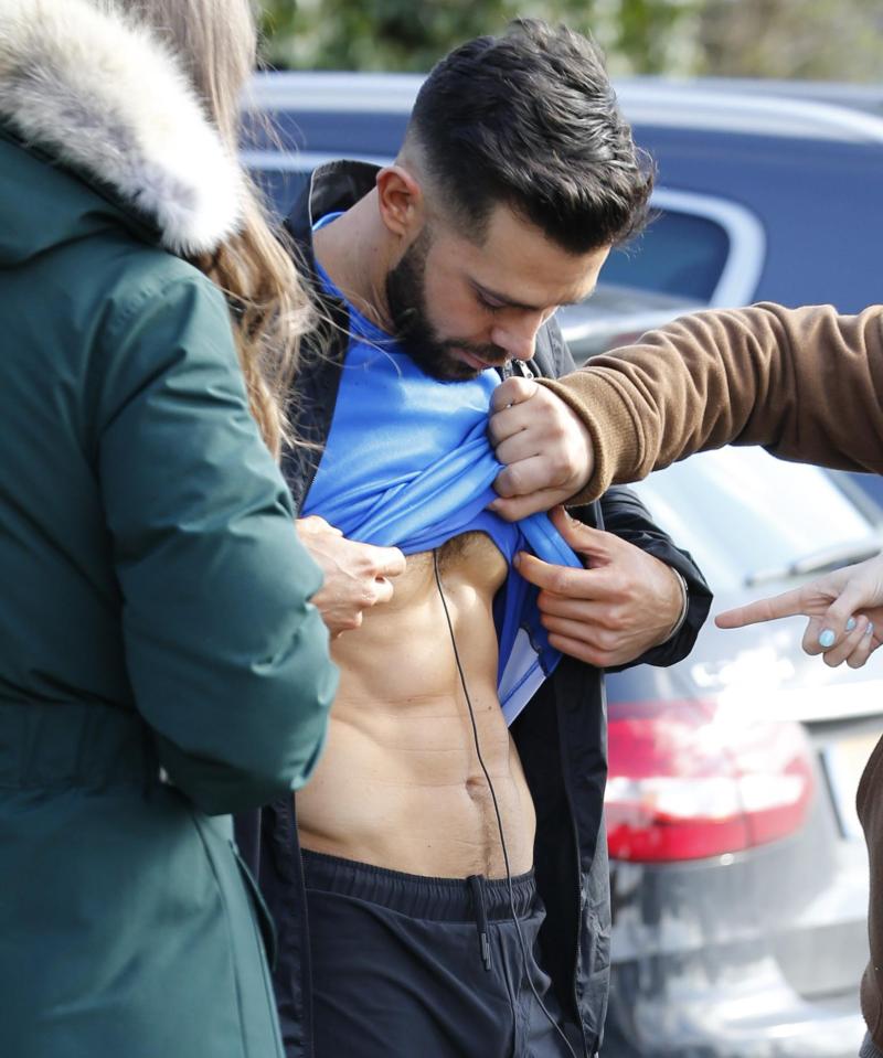  The reality star turned personal trainer has been showing off his abs on set