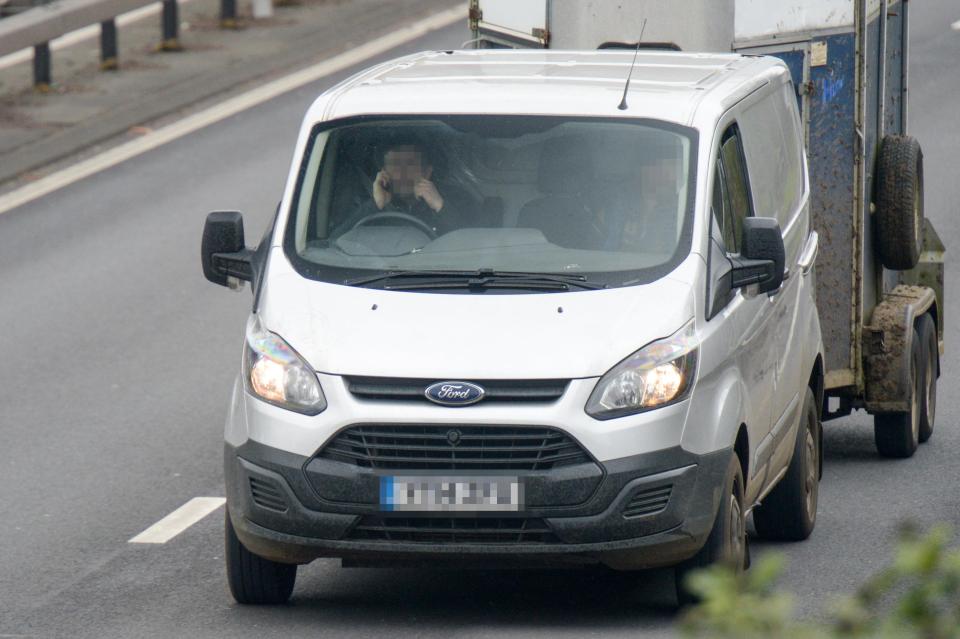  People driving on the A3 through Guildford were spotted using their mobile phones today as the law changed