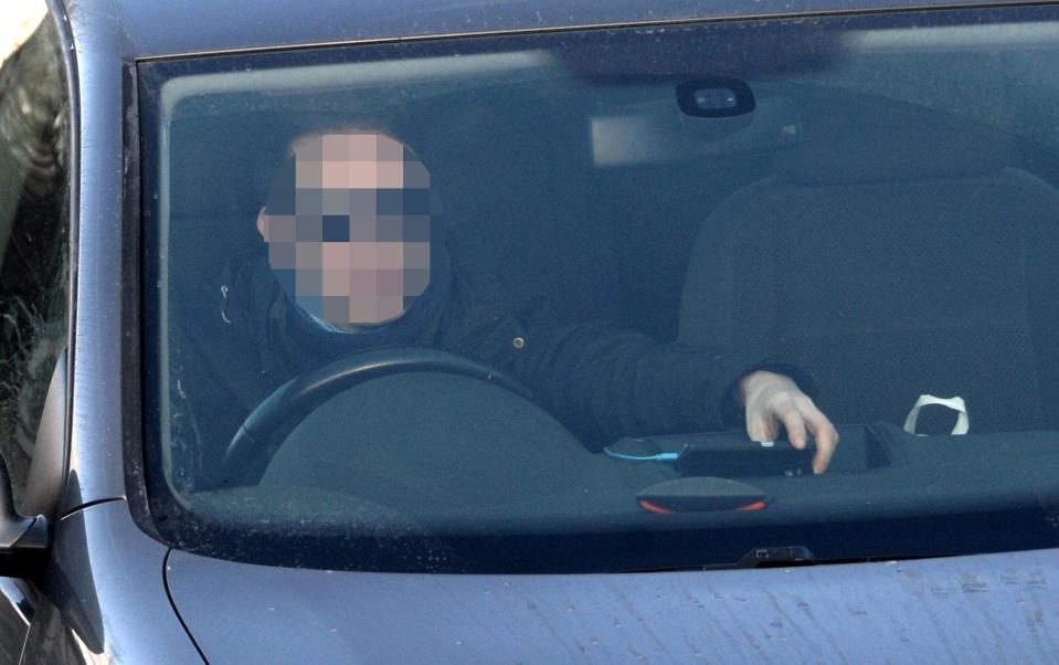  A driver touching his mobile phone while driving on the M8 through Glasgow