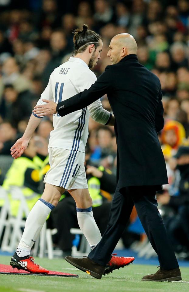  The Welshman takes the walk of shame past boss Zinedine Zidane