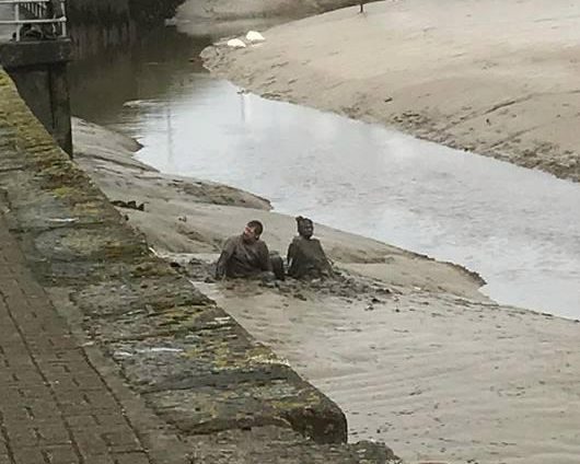  The couple were seen floundering in the mud as rescuers arrived