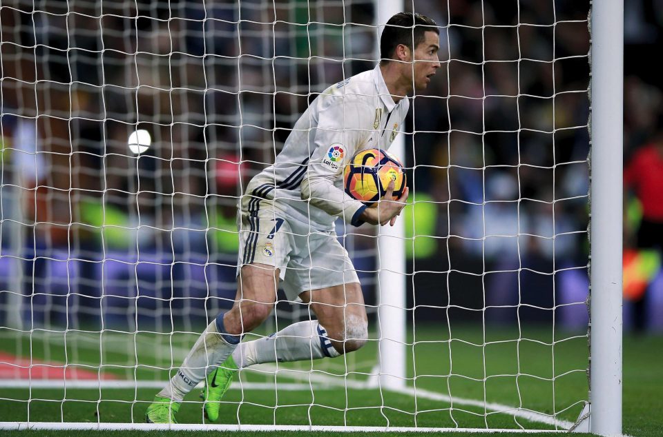  Cristiano Ronaldo picks the ball out of the net after his late equaliser against Las Palmas