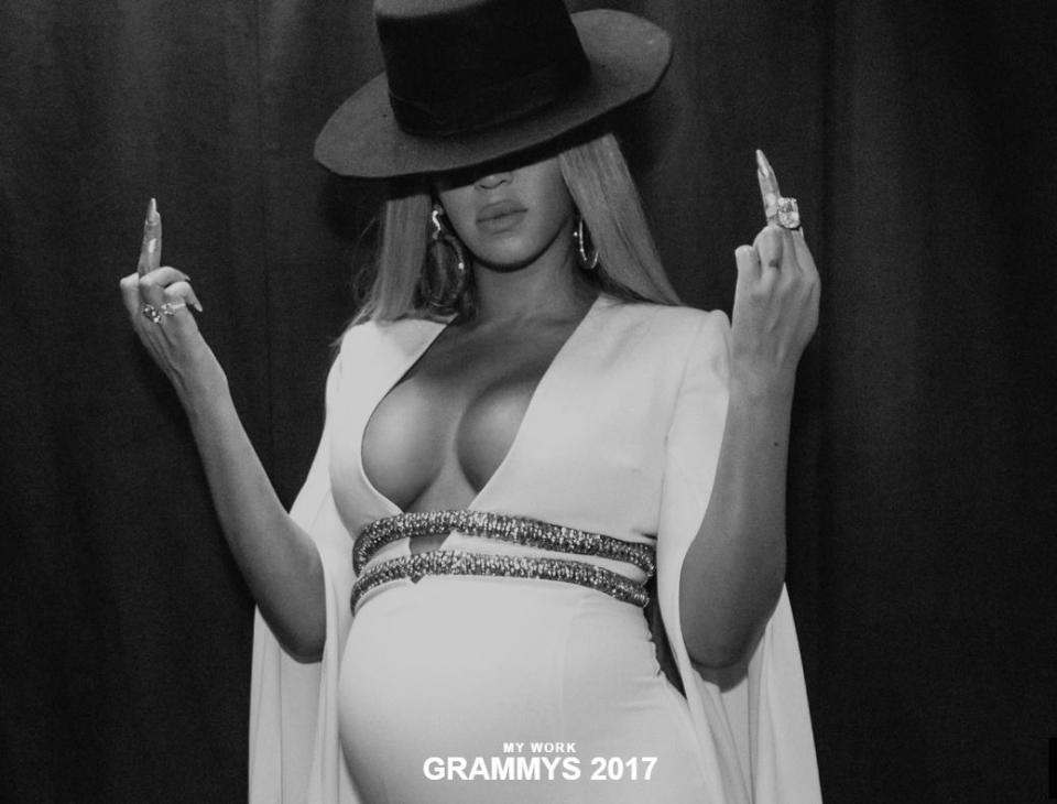  Bey is 'basically putting up her middle finger' in her bump-baring pics, said our source