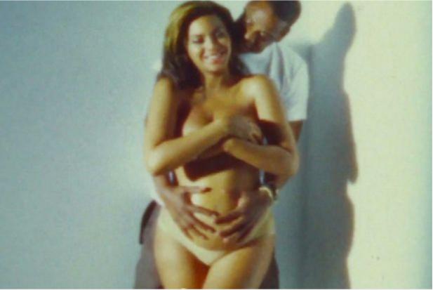  She  released a photo of Jay Z cradling her bump years earlier