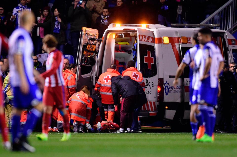  Antoine Griezmann watches on as Torres is put into the ambulance