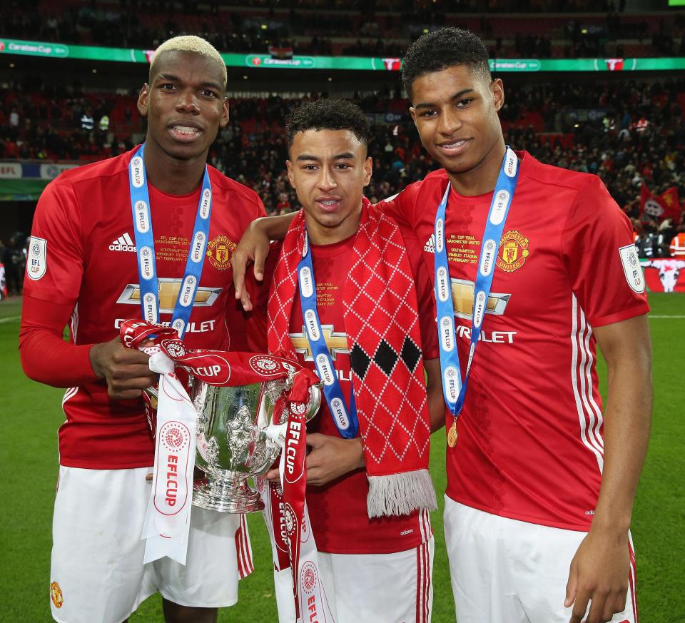  Jesse Lingard celebrates the EFL Cup win with Manchester United team-mates Paul Pogba and Marcus Rashford