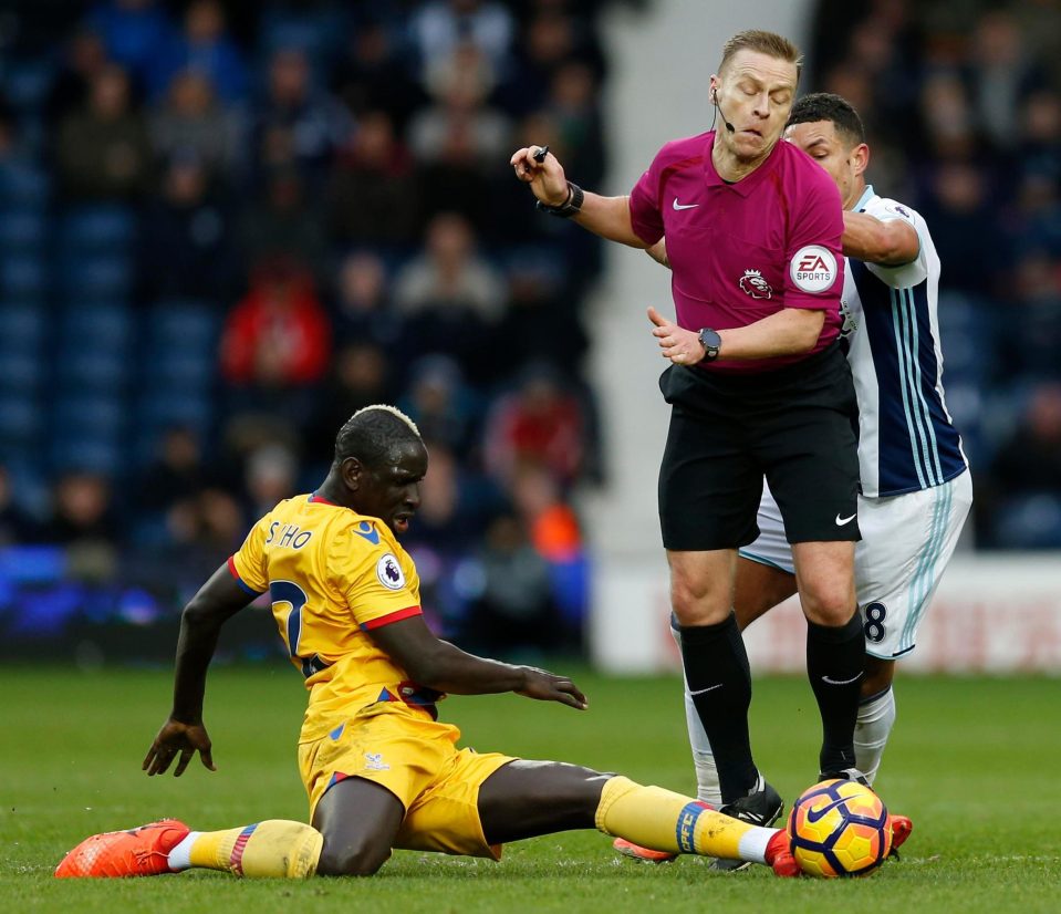  On-loan Palace star Mamadou Sakho launches a perfect tackle - but unfortunately it is on ref Mike Jones