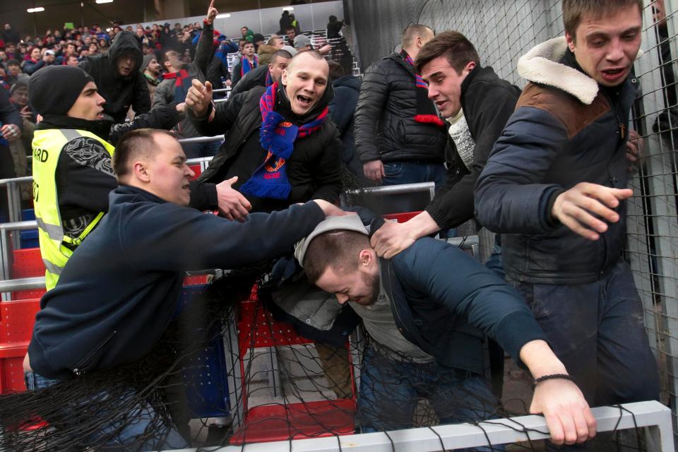  Supporters traded punches and kicks in the stands during the draw