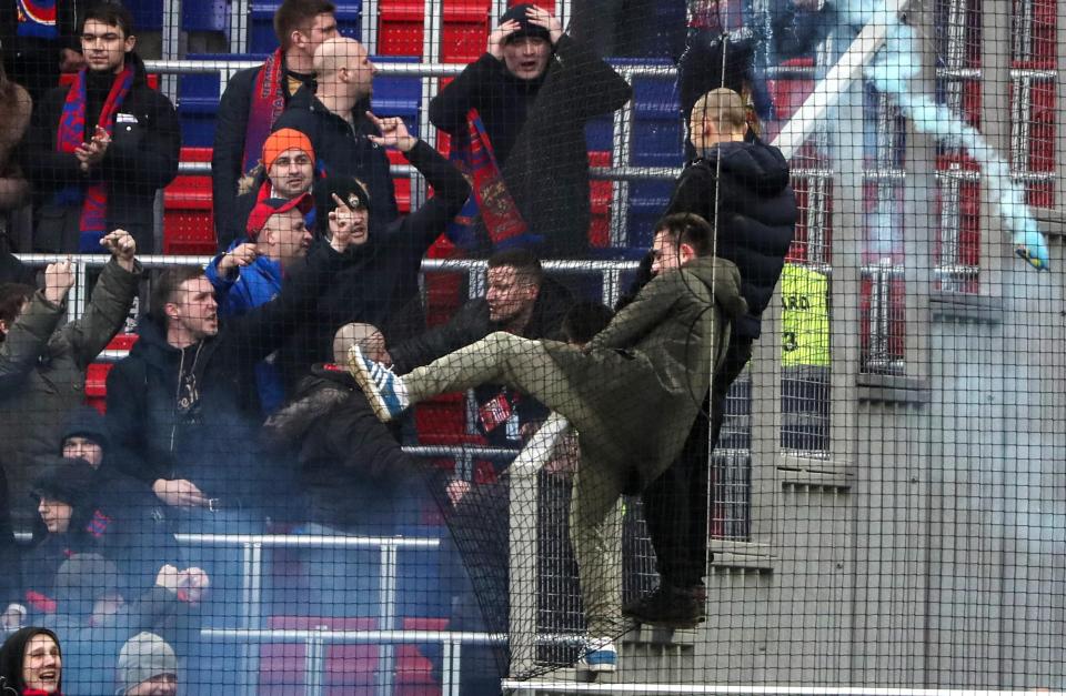  Supporters were able to get past the huge metal fence separating the fans