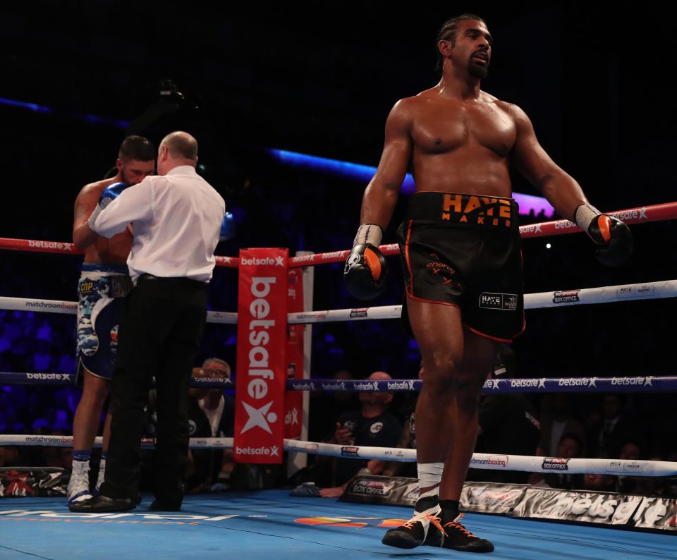  David Haye limps back to his corner as he fights on despite the pain against Tony Bellew