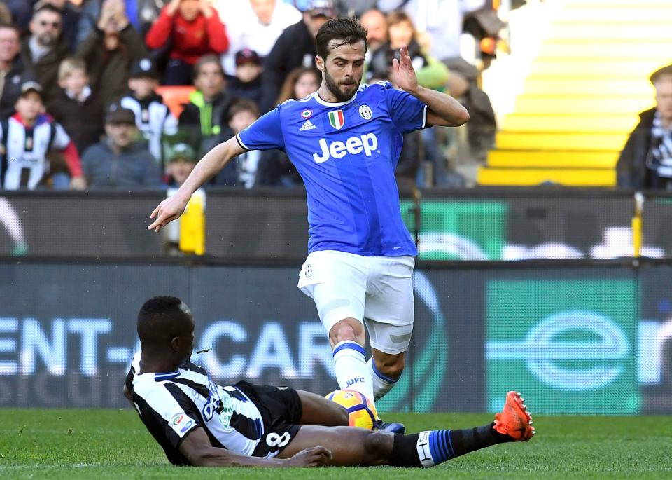  Miralem Pjanic in action during a fiery affair against Udinese in Serie A