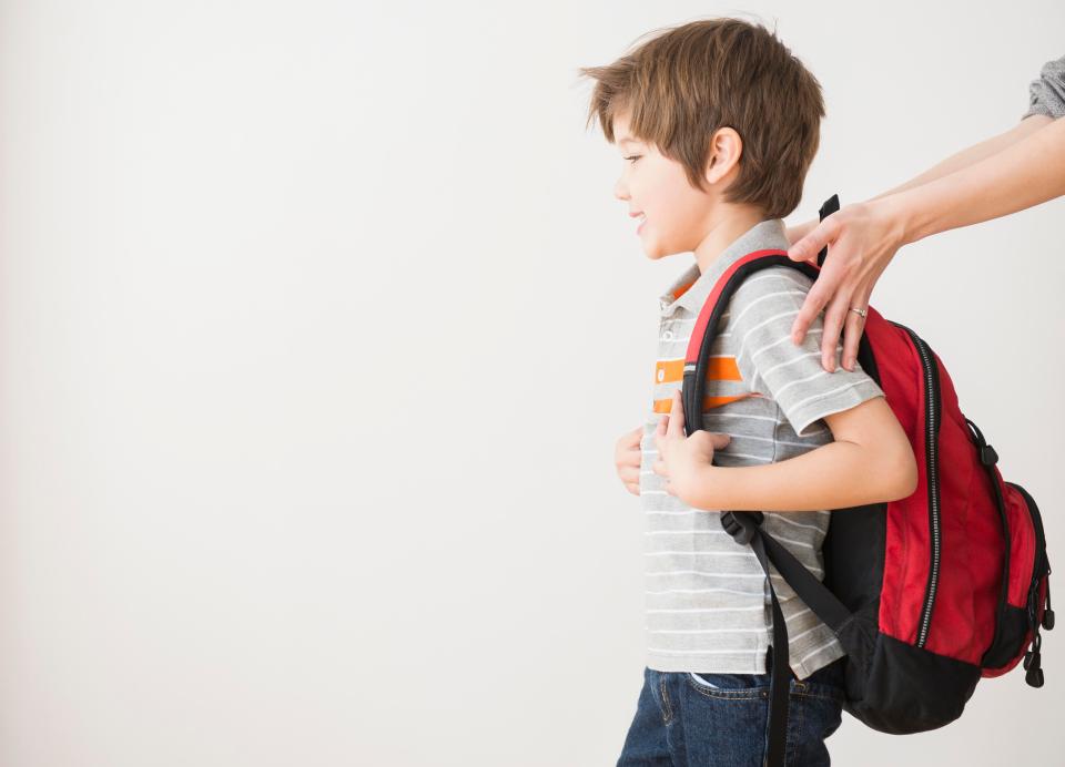  Almost half of school kids lug around bags that are too heavy, placing strain on their spines and causing back pain