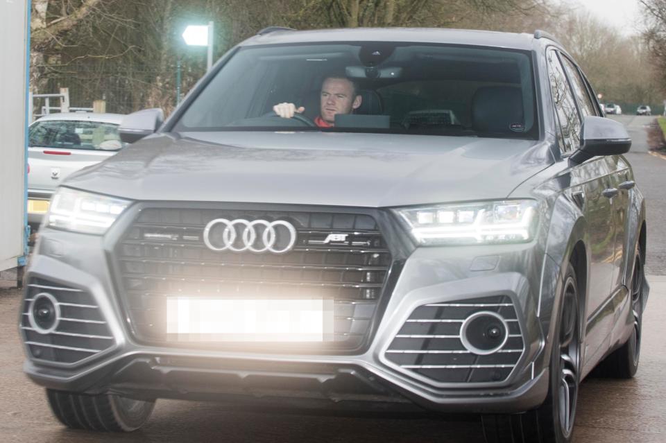  Wayne Rooney drives into Carrington today