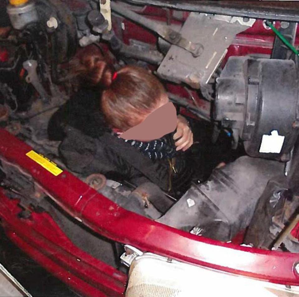  A woman was caught attempting to be smuggled into Britain inside the engine compartment of a van