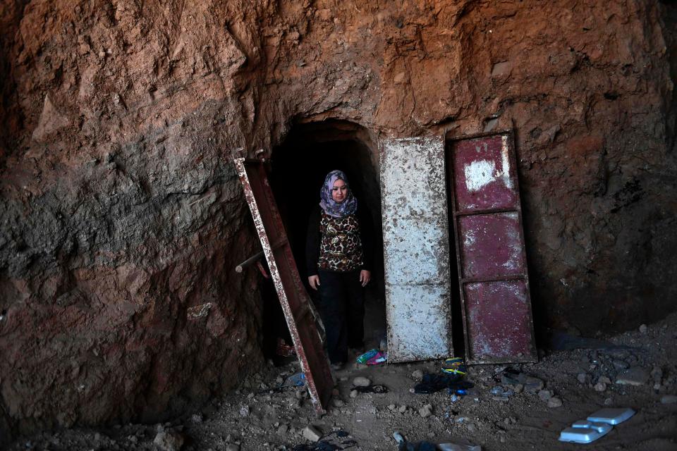  Layla Salih, head of antiquities for Nineveh province, stands by the entrance of one of the tunnels