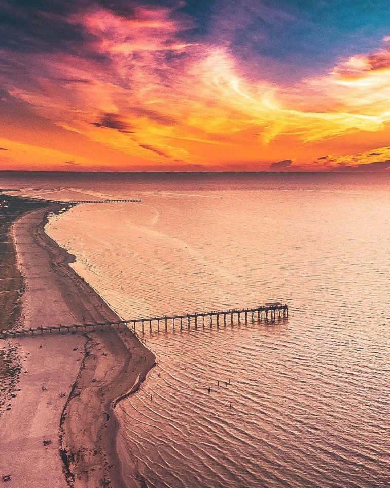 A jaw-dropping sunset at Largs Bay Jetty is captured from on high