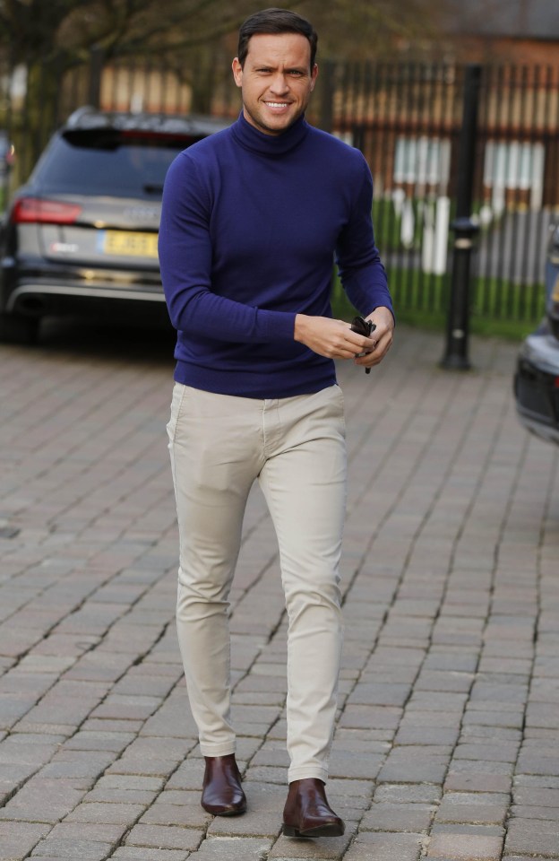 Jamie wore a deep blue polo neck for the meeting