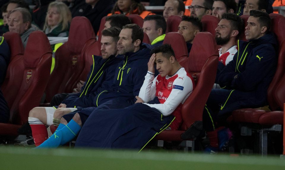  Alexis holds his head in his hands after another forgetful night for his team